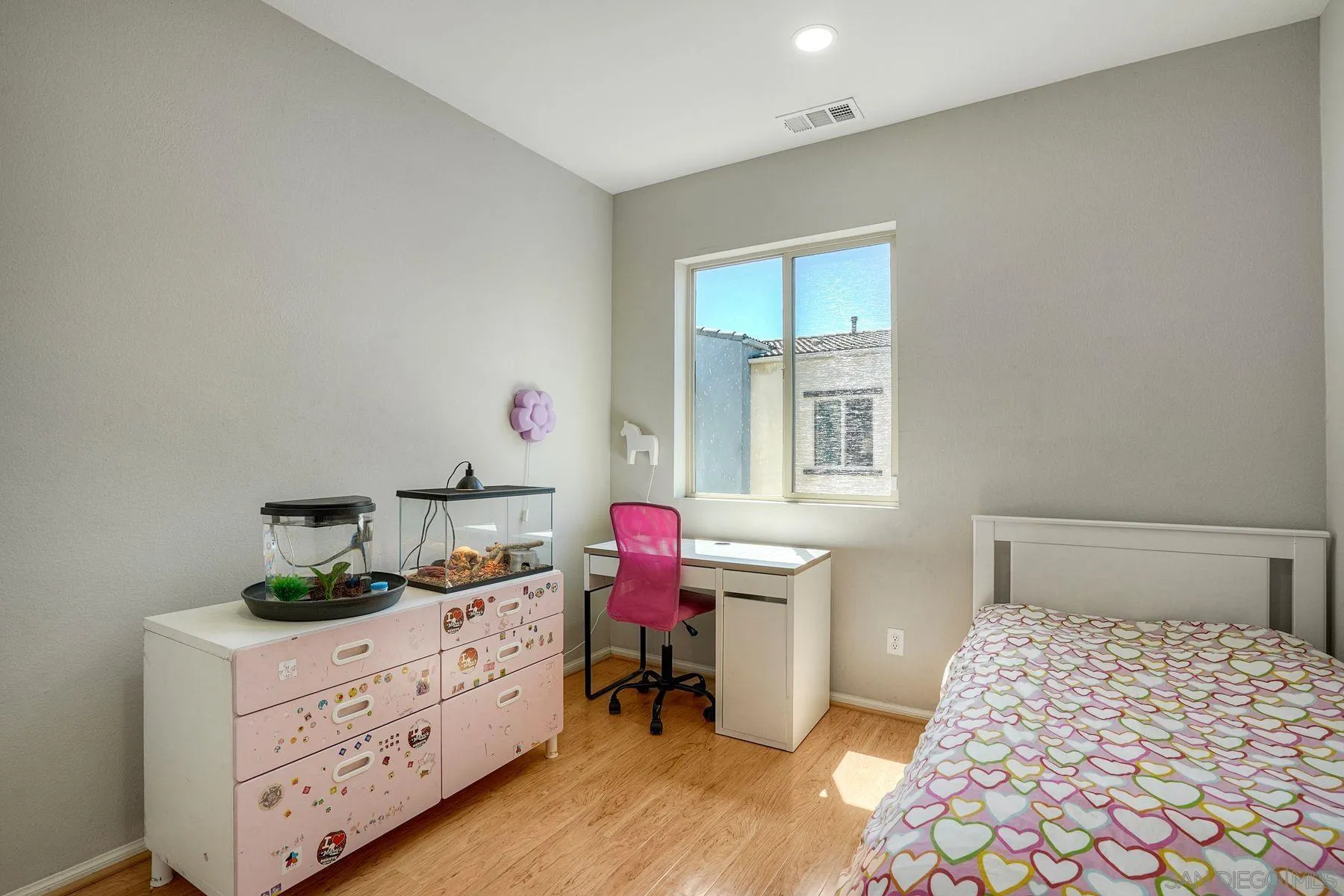 8850 Olive Lane, Unit 7 Santee, CA 92071 - Photo 21 of 27 a bedroom with a bed and wooden floor