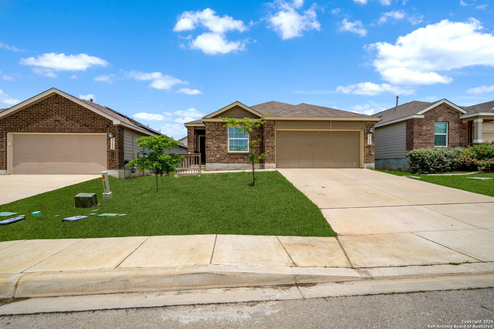 31646 Untrodden Way Bulverde, TX 78163 - Photo 1 of 36 a front view of a house with a yard and garage