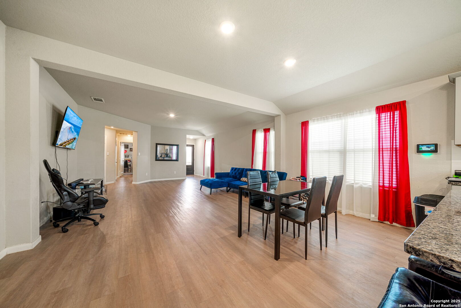 31646 Untrodden Way Bulverde, TX 78163 - Photo 11 of 36 a view of a dining room with furniture and wooden floor
