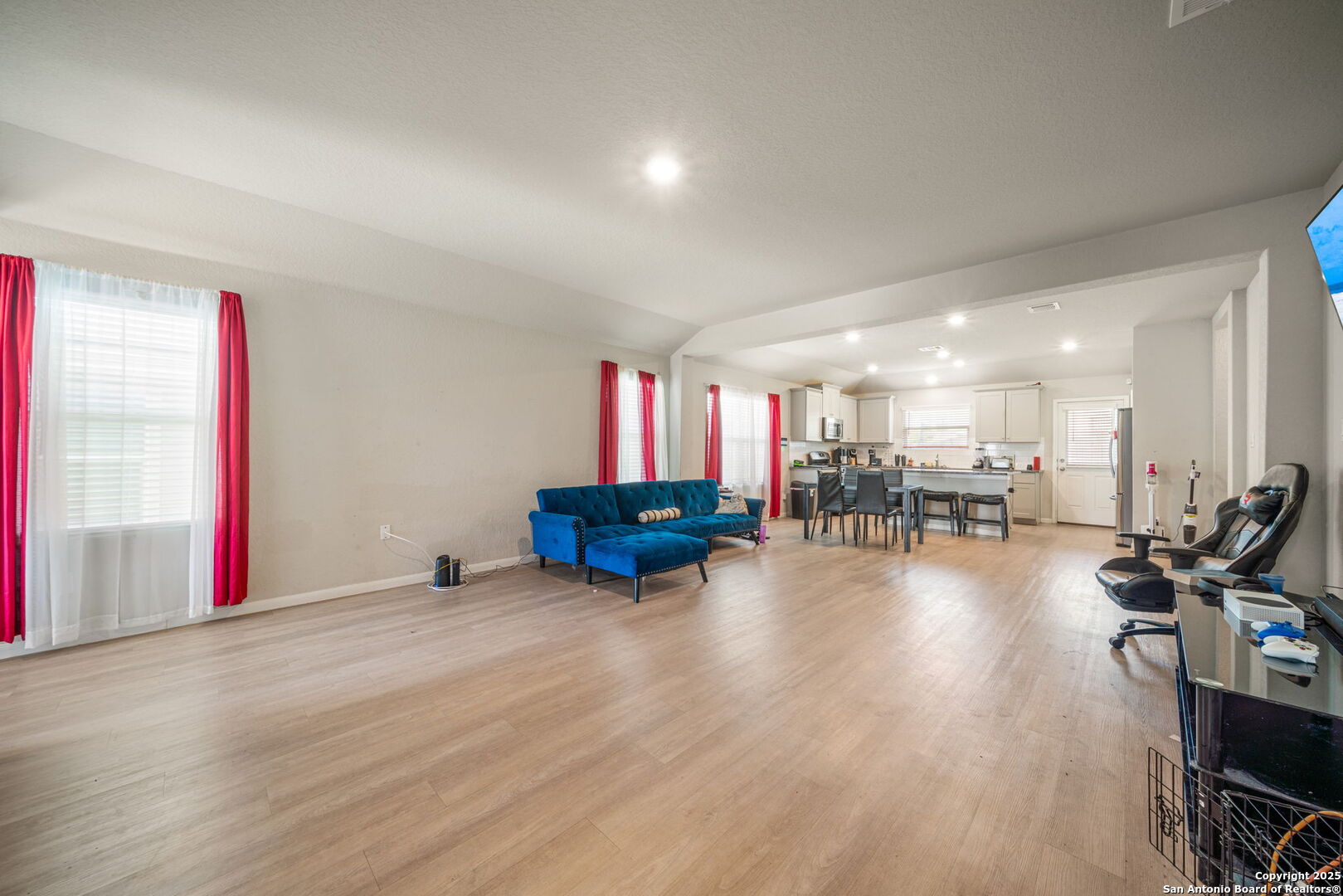 31646 Untrodden Way Bulverde, TX 78163 - Photo 12 of 36 a view of a room with lots of chairs and wooden floor