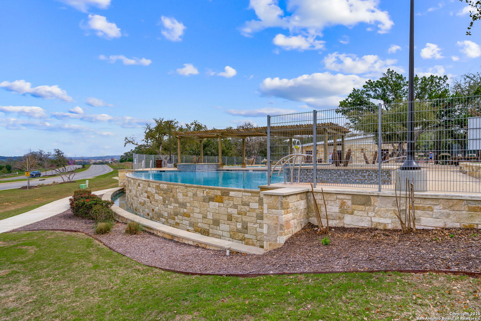 31646 Untrodden Way Bulverde, TX 78163 - Photo 34 of 36 a view of a swimming pool with a lake view
