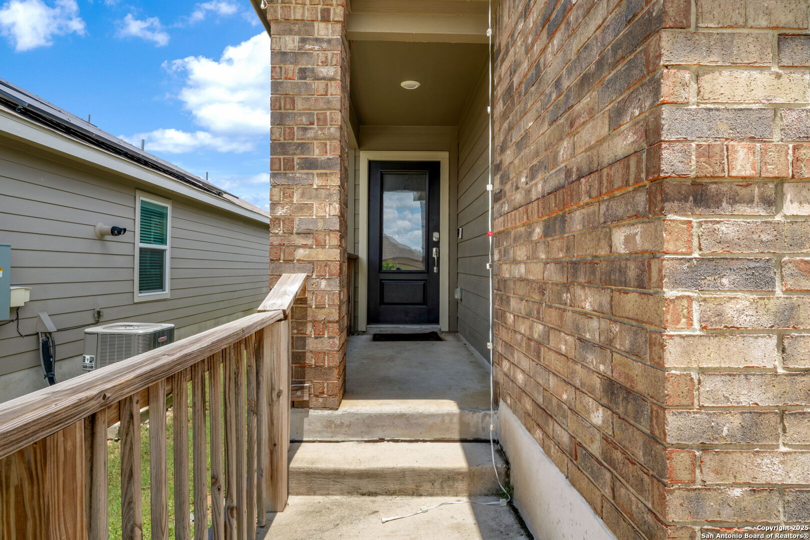 31646 Untrodden Way Bulverde, TX 78163 - Photo 4 of 36 a balcony of a house with wooden floor and stairs