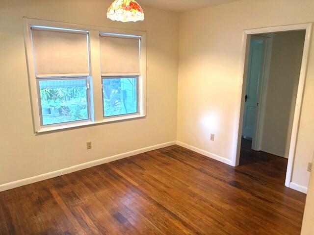 44 Southwest 5th Street Dania Beach, FL 33004 - Photo 15 of 43 an empty room with wooden floor and windows