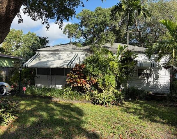 44 Southwest 5th Street Dania Beach, FL 33004 - Photo 2 of 43 a view of a house with a yard and potted plants