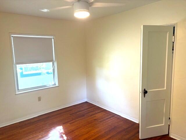 44 Southwest 5th Street Dania Beach, FL 33004 - Photo 21 of 43 an empty room with wooden floor and windows