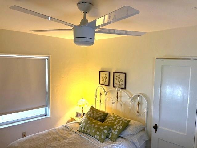 44 Southwest 5th Street Dania Beach, FL 33004 - Photo 24 of 43 a bedroom with a bed and wooden floor