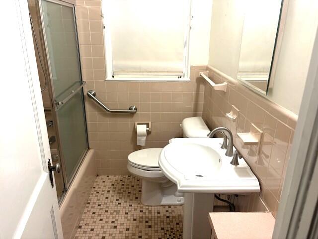 44 Southwest 5th Street Dania Beach, FL 33004 - Photo 28 of 43 a bathroom with a sink a toilet and a mirror