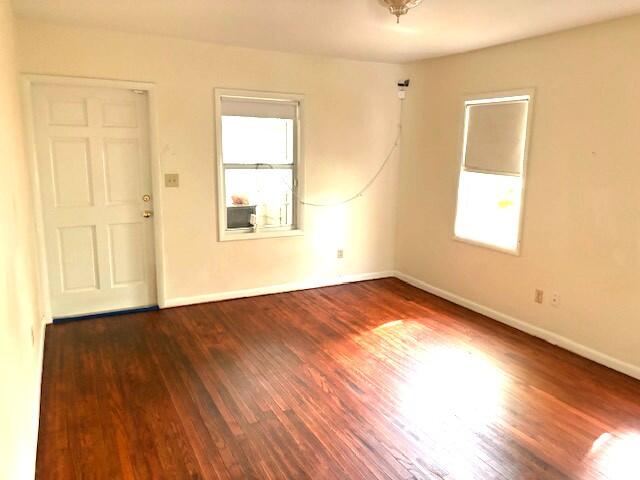 44 Southwest 5th Street Dania Beach, FL 33004 - Photo 3 of 43 an empty room with wooden floor and windows