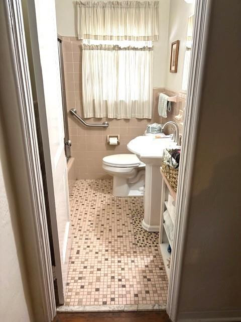 44 Southwest 5th Street Dania Beach, FL 33004 - Photo 32 of 43 a bathroom with a sink a toilet a mirror and a shower