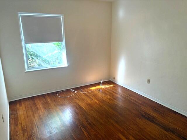 44 Southwest 5th Street Dania Beach, FL 33004 - Photo 36 of 43 an empty room with wooden floor and windows