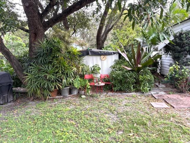 44 Southwest 5th Street Dania Beach, FL 33004 - Photo 39 of 43 a view of a house with a tree and a yard