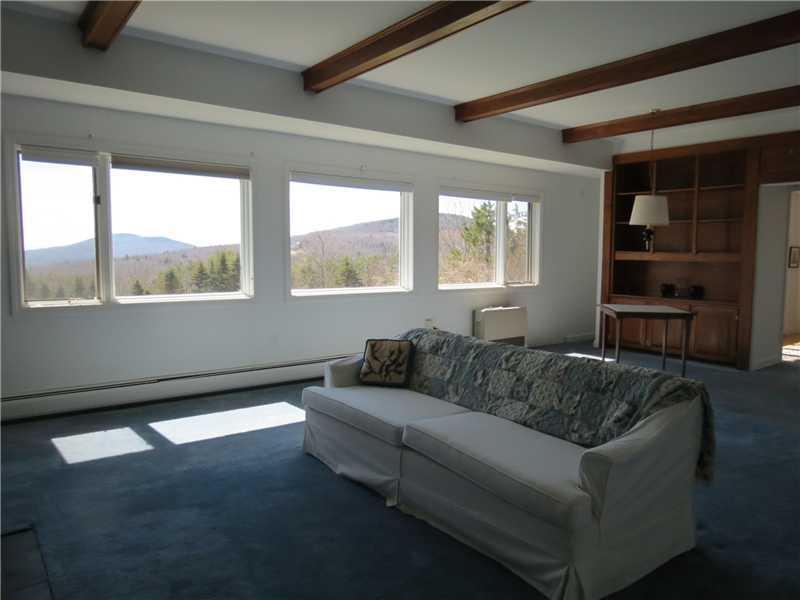 771 Camden Road Hope, ME 04847 - Photo 12 of 27 Living Room. Large living room with...