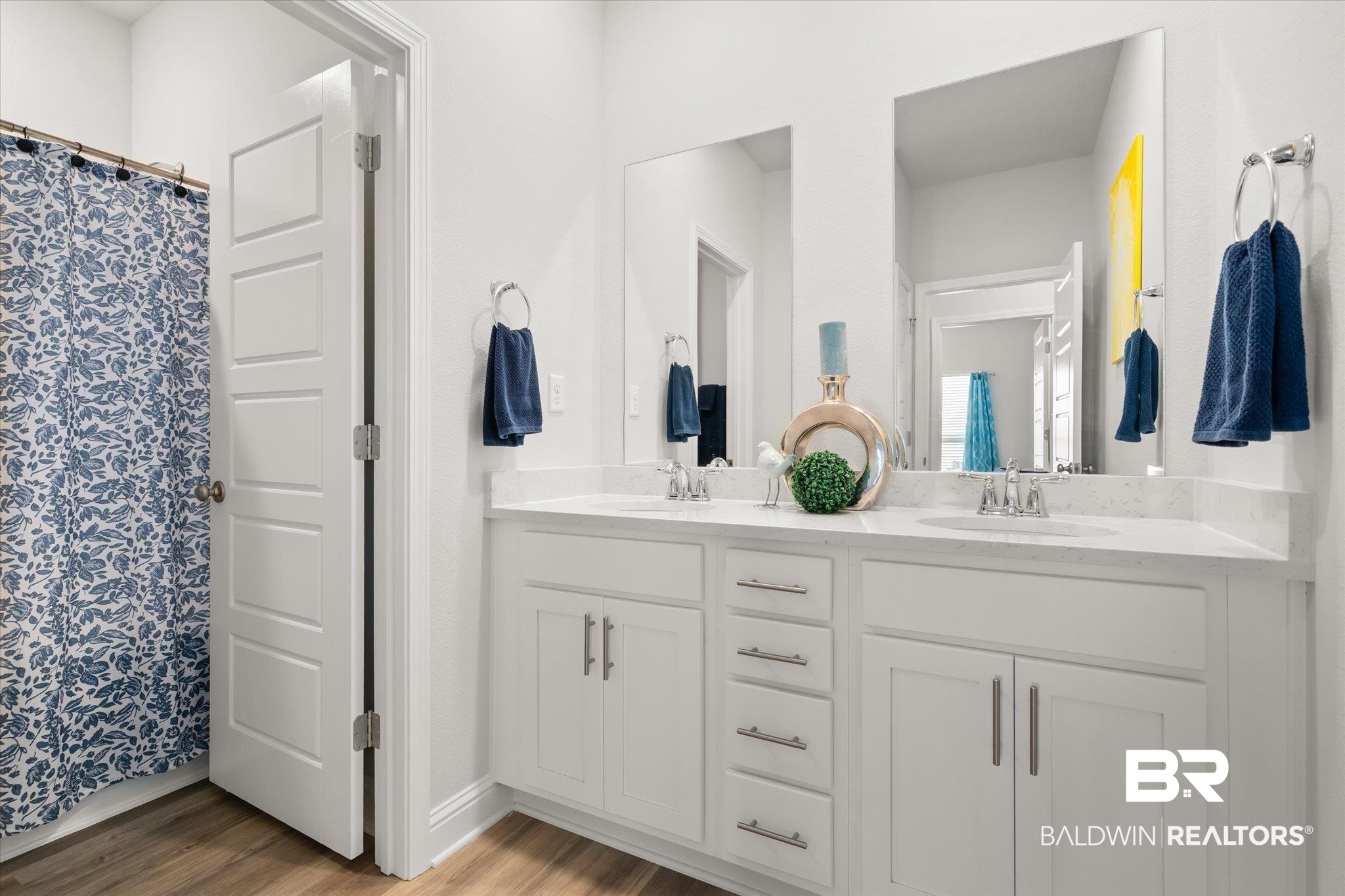 1167 Provision Road Mobile, AL 36608 - Photo 13 of 20 Full bath with double vanity, a shower with curtain, wood finished floors, and a sink