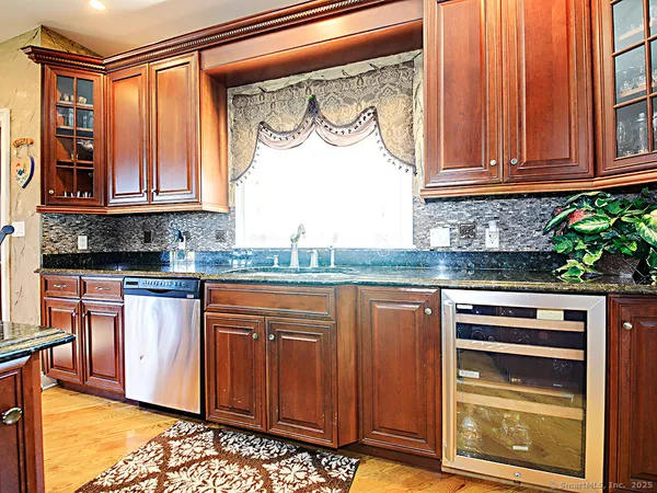a kitchen with stainless steel appliances granite countertop a stove and a microwave