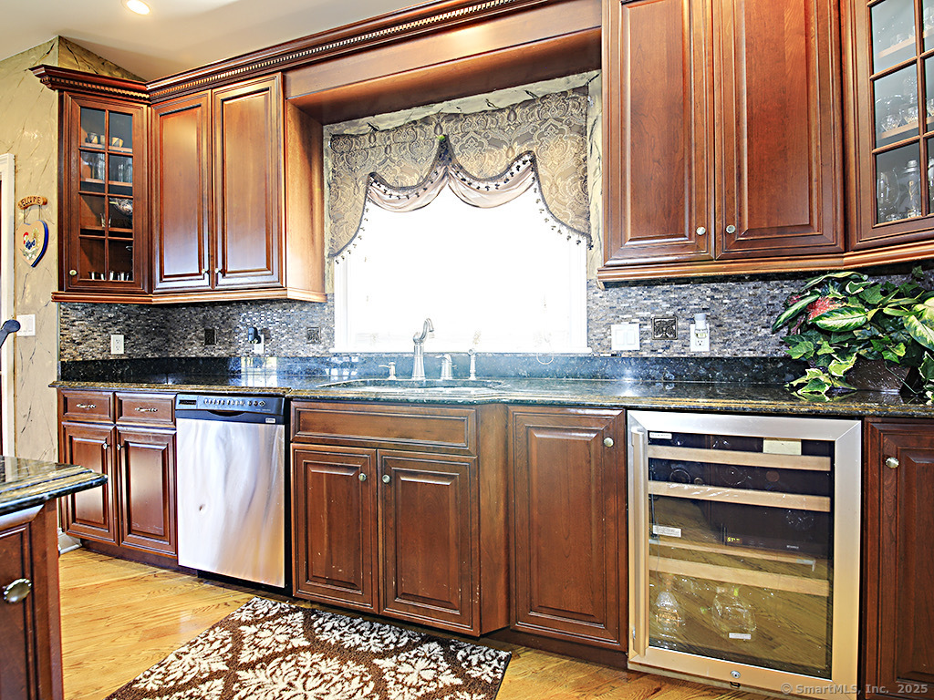 114 Wheeler Farm Road Watertown, CT 06795 - Photo 11 of 23 a kitchen with stainless steel appliances granite countertop a stove and a microwave