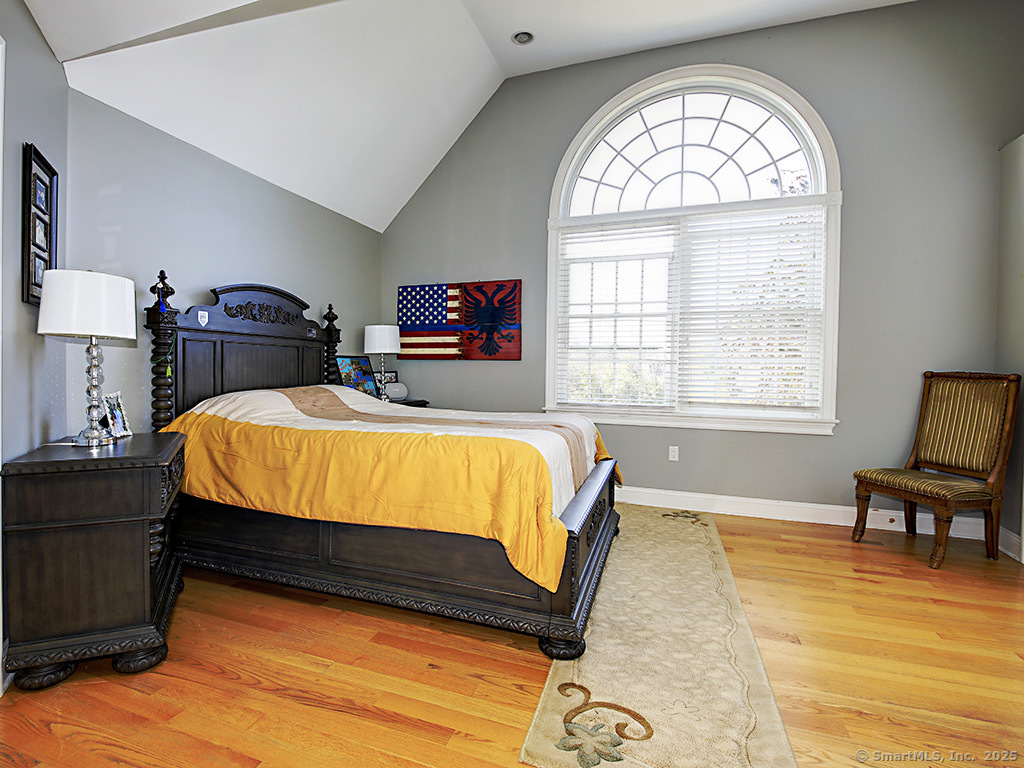 114 Wheeler Farm Road Watertown, CT 06795 - Photo 18 of 23 a bed sitting in a bedroom next to a window