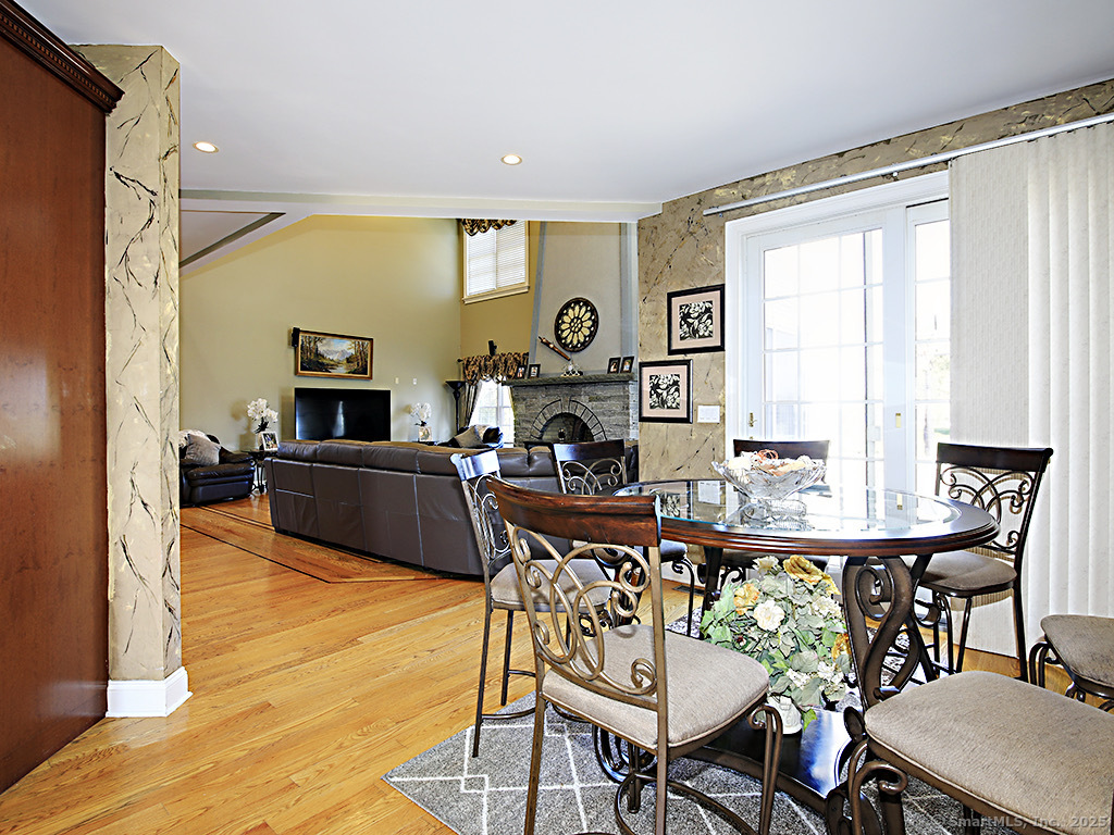 114 Wheeler Farm Road Watertown, CT 06795 - Photo 6 of 23 a living room with furniture a table and a large window
