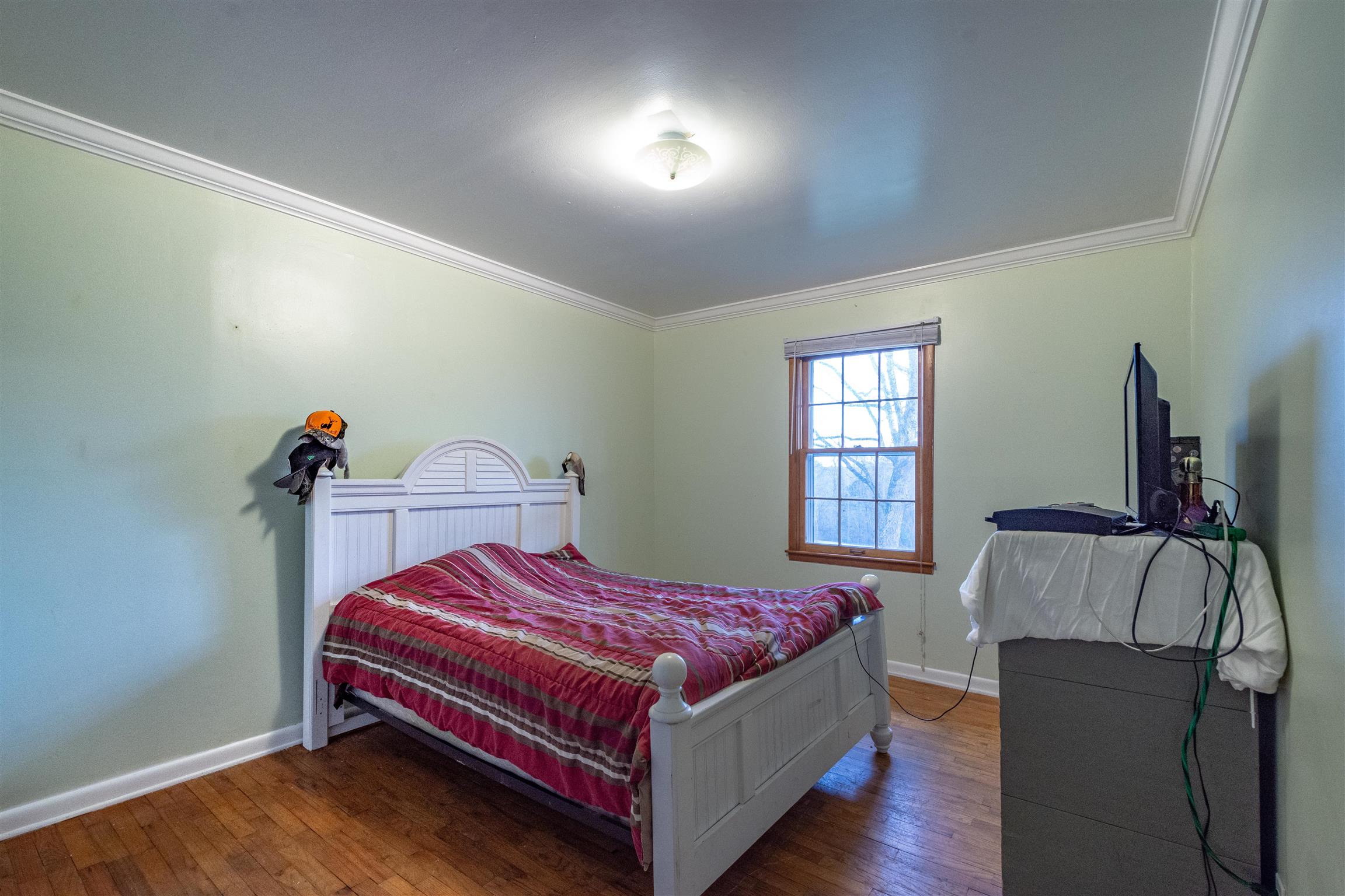 1666 Prospect Elkton Road Prospect, TN 38477 - Photo 17 of 30 a bedroom with a bed and window