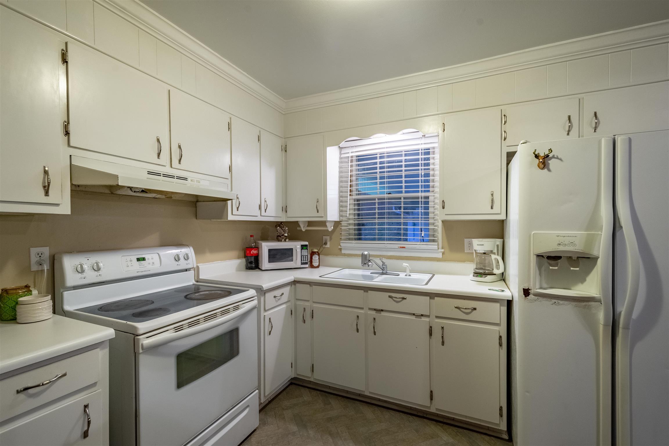 1666 Prospect Elkton Road Prospect, TN 38477 - Photo 7 of 30 a kitchen with cabinets appliances a sink and a window