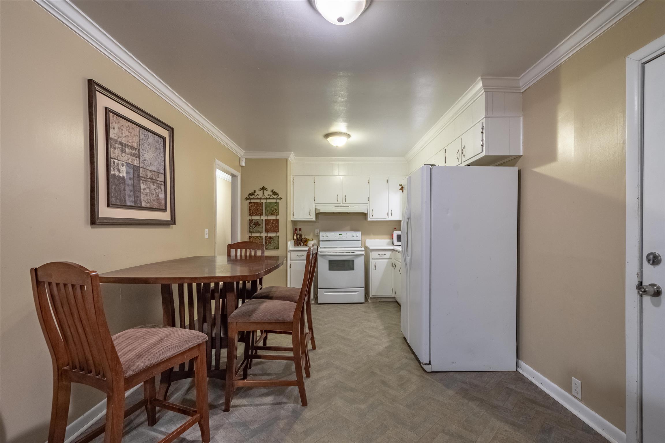 1666 Prospect Elkton Road Prospect, TN 38477 - Photo 10 of 30 a dining room with furniture and a refrigerator