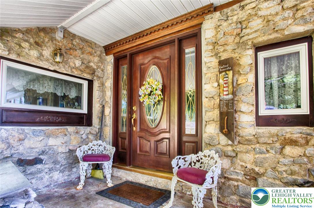 5449 Depues Road Bangor, PA 18013 - Photo 35 of 39 a front view of a house with outdoor seating area