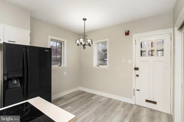 a view of room with window and hardwood floor