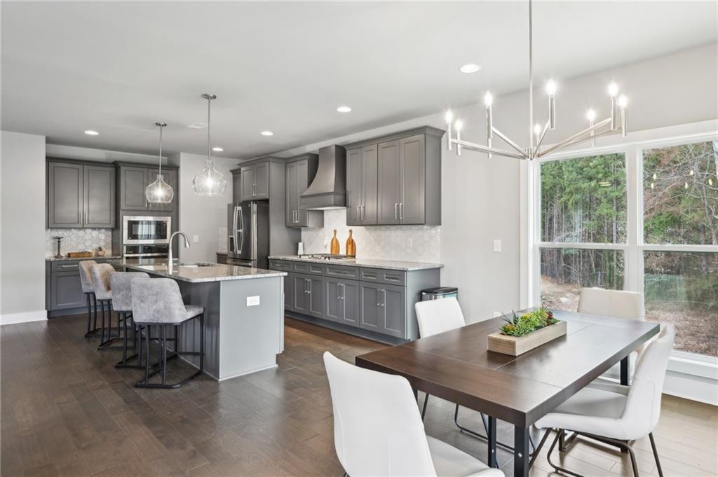 3143 Stonegate Drive Atlanta, GA 30331 - Photo 11 of 32 a kitchen with a table chairs sink and cabinets