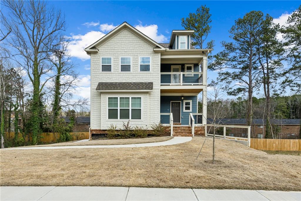 3143 Stonegate Drive Atlanta, GA 30331 - Photo 2 of 32 a front view of a house with a yard