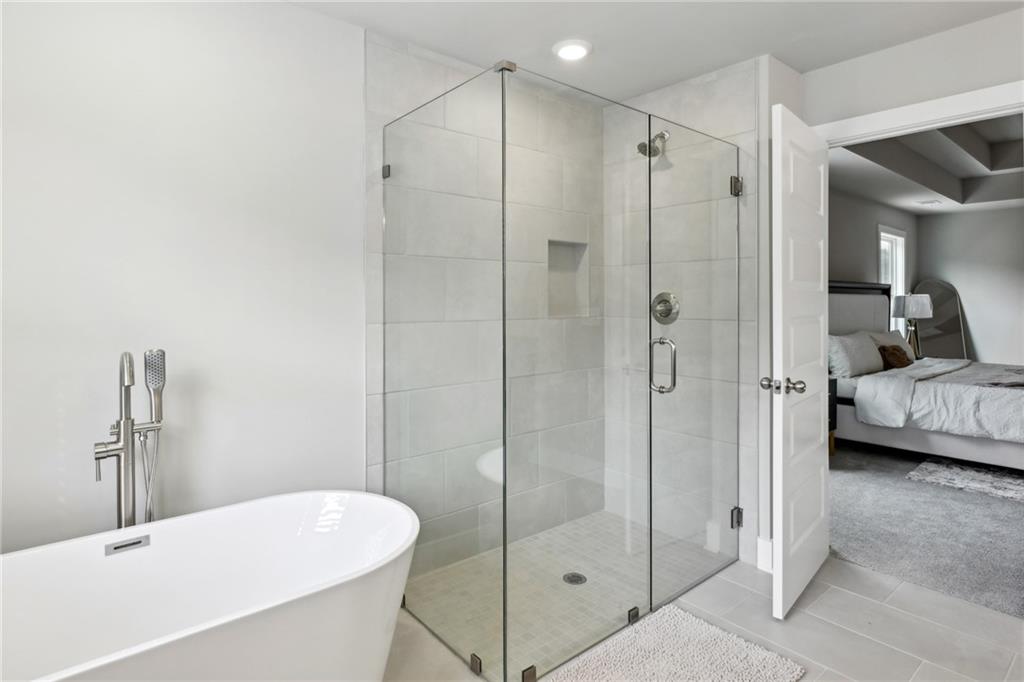 3143 Stonegate Drive Atlanta, GA 30331 - Photo 21 of 32 a bathroom with a shower and a sink