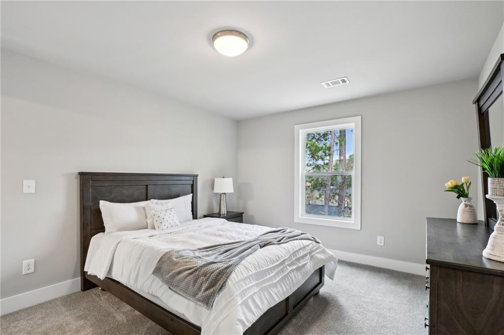 3143 Stonegate Drive Atlanta, GA 30331 - Photo 25 of 32 a bedroom with a bed and window