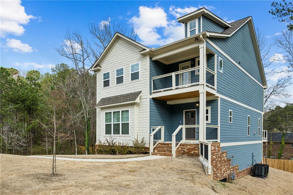3143 Stonegate Drive Atlanta, GA 30331 - Photo 3 of 32 a front view of a house with garden