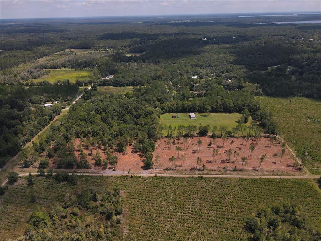 1475 Northeast Rd Gainesville Road Waldo, FL 32694 - Photo 2 of 22 a view of a lake with a mountain in the background
