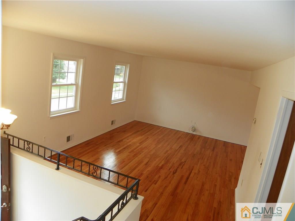 27 Greenwich Road Edison, NJ 08820 - Photo 4 of 23 a view of an empty room and window