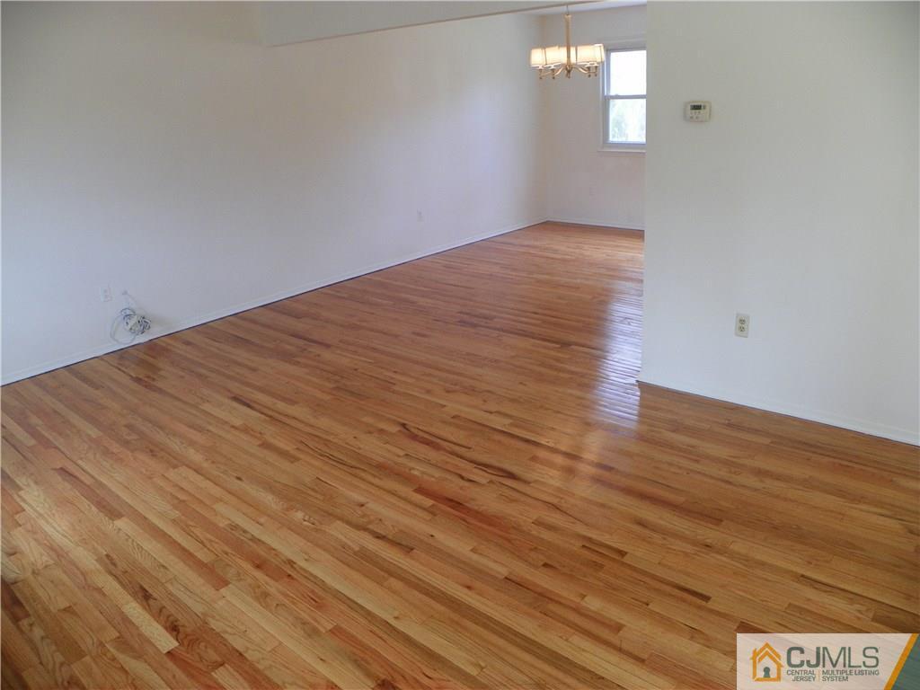 27 Greenwich Road Edison, NJ 08820 - Photo 5 of 23 a view of empty room with wooden floor