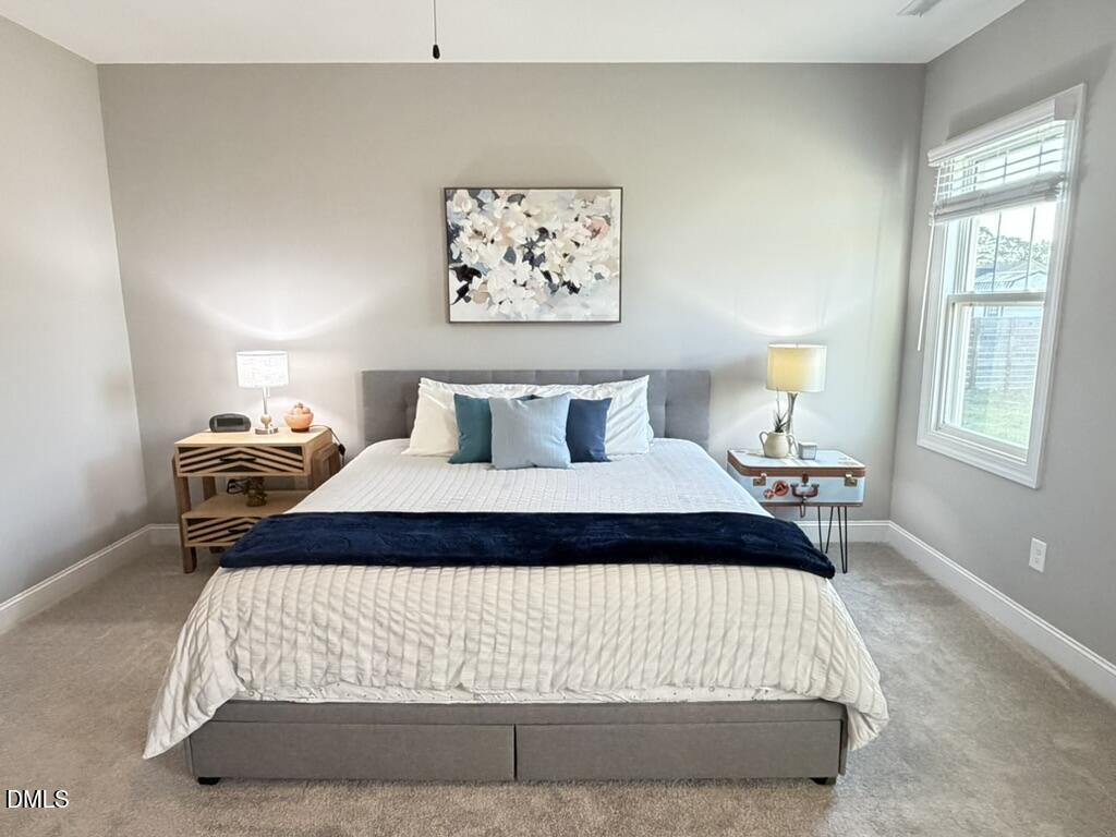 88 Heath Road Lillington, NC 27546 - Photo 9 of 54 a bedroom with bed and window