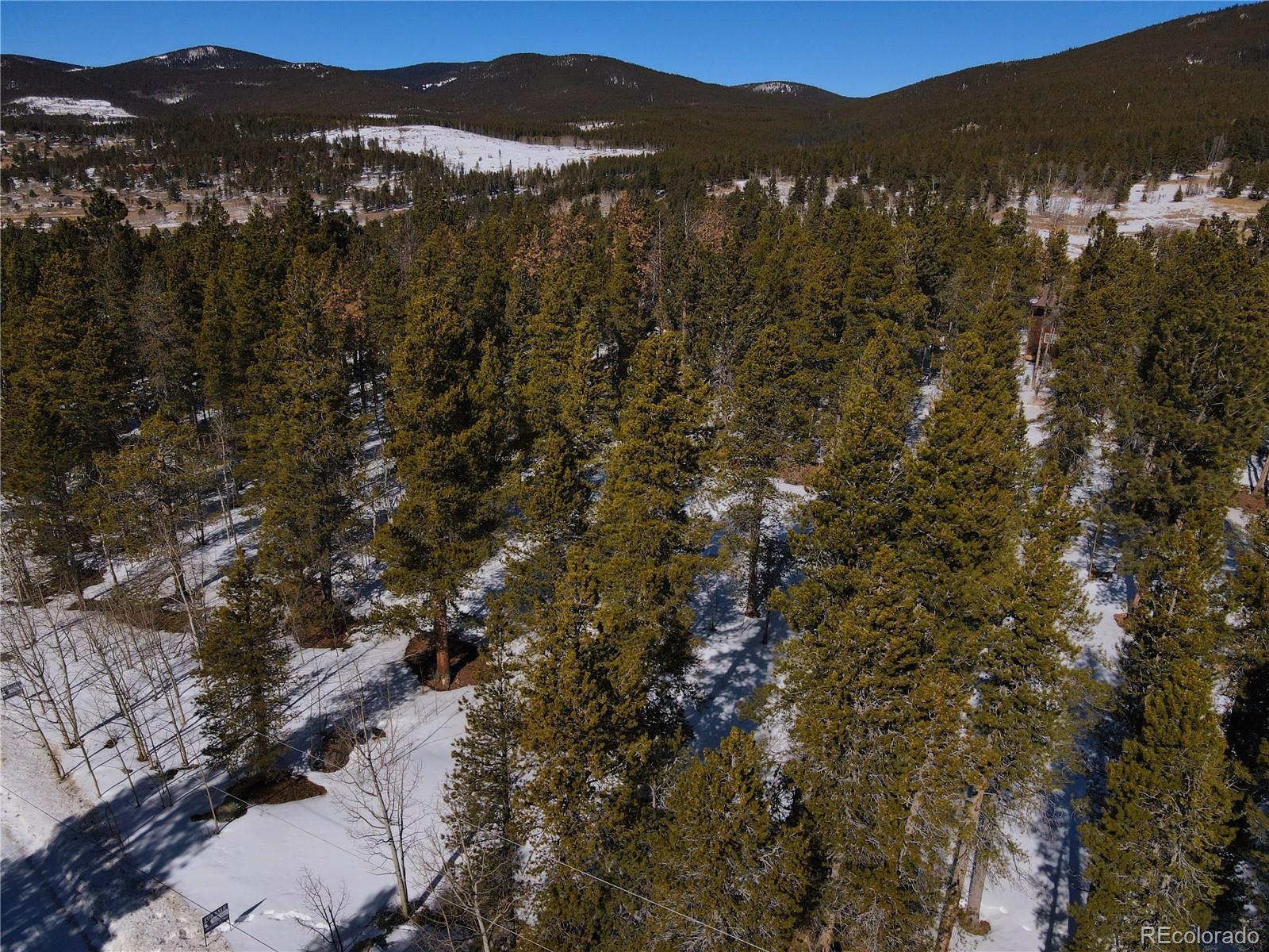 119 Cedar Way Black Hawk, CO 80422 - Photo 30 of 31 a view of a town with mountains in the background