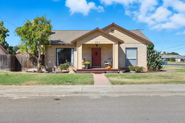 a front view of a house with a yard