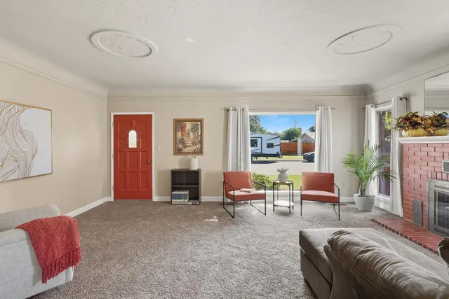 a living room with furniture and a fireplace