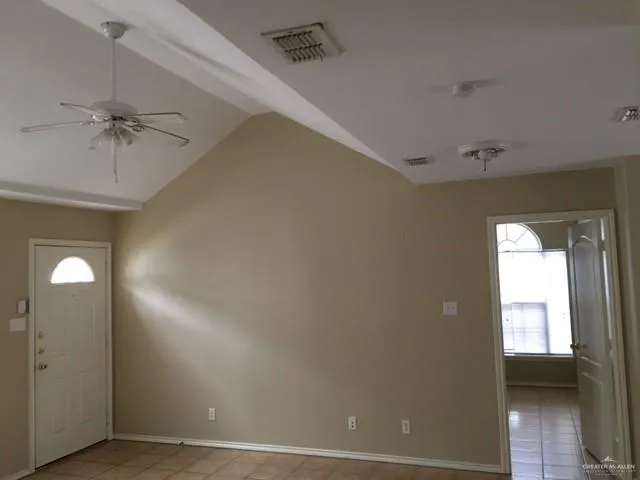 a view of a kitchen with white cabinets