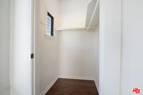 a view of hallway with wooden floor
