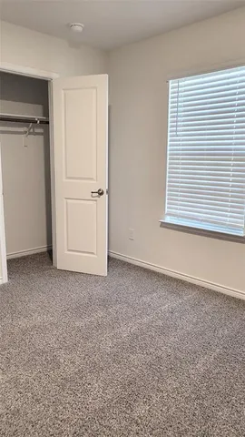 a view of a room that has a window in it