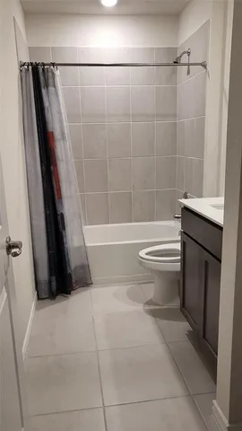 a bathroom with a toilet a sink and a bathtub
