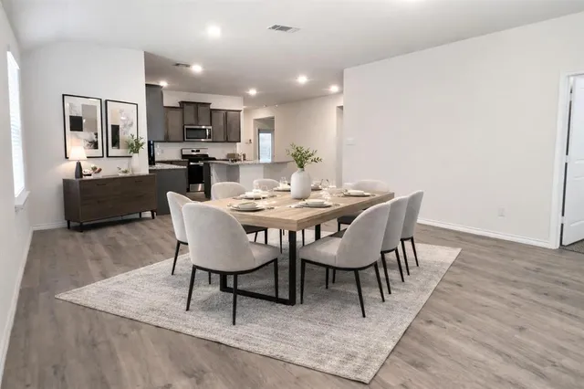 a view of a dining room with furniture