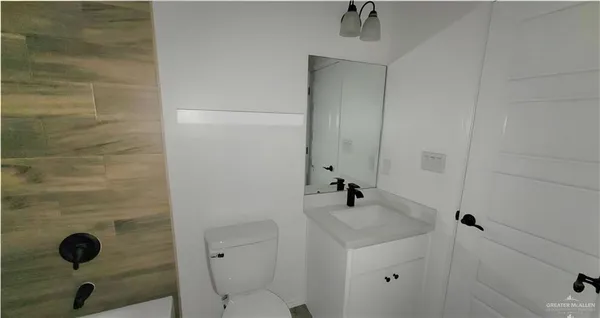 a bathroom with a sink and mirror