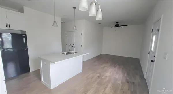 a view of a bathroom with a sink mirror and shower