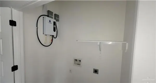 a bathroom with a shower and mirror