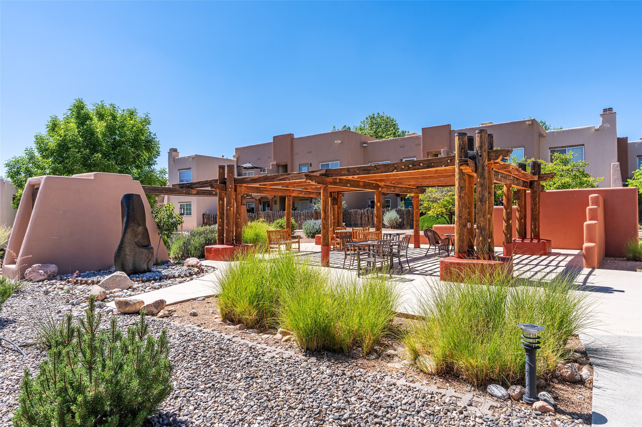 2210 Miguel Chavez Road, Unit 1423 Santa Fe, NM 87505 - Photo 21 of 26 outdoor fireplace gathering