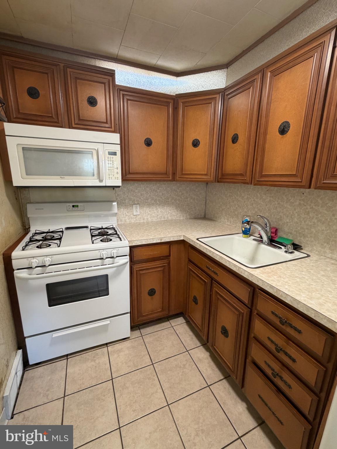 1034 Cedarwood Road Glenolden, PA 19036 - Photo 10 of 26 Cozy kitchen with classic wood cabinetry.