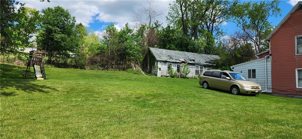 2014 5th Street Cardale, PA 15420 - Photo 10 of 11 a white house sitting in the middle of a field