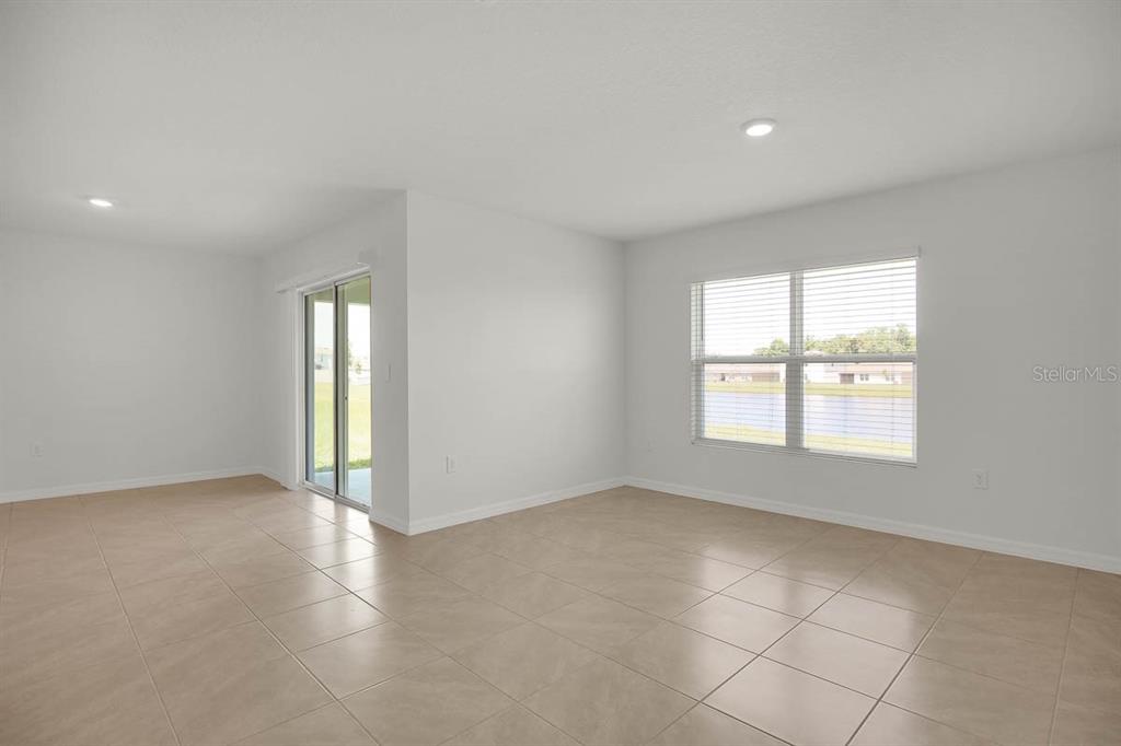 16530 Windmill Forge Pass Wimauma, FL 33598 - Photo 11 of 33 a view of an empty room with a window